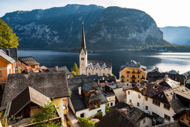 The village of Hallstatt early in the morning with the calm water of the Hallstattersee in the back.