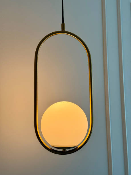 istock Golden Pendant Light with Modern Glowing Sphere 2201209248