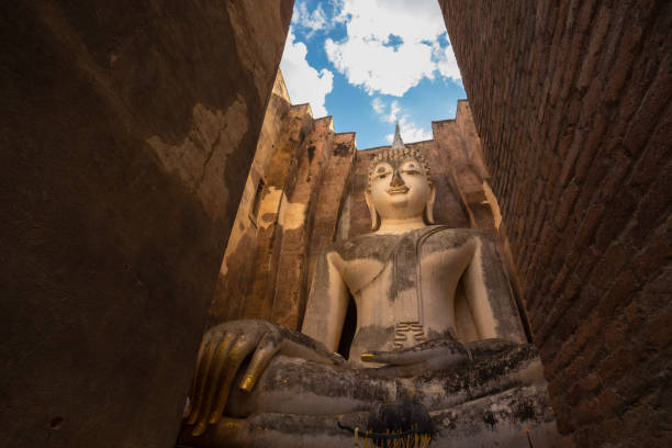 Wat Sri Chum is an ancient religious site located outside the Sukhothai Historical Park, Sukhothai. This temple enshrines a large Buddha statue in the Mara-Vijaya posture, named \