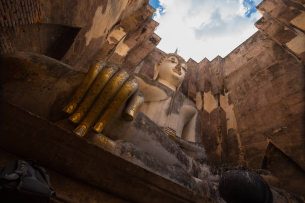 Wat Sri Chum is an ancient religious site located outside the Sukhothai Historical Park, Sukhothai. This temple enshrines a large Buddha statue in the Mara-Vijaya posture, named \