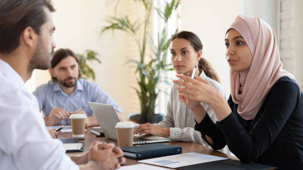 istock Businesswoman middle eastern ethnicity leader talking with partner at meeting 2201213762