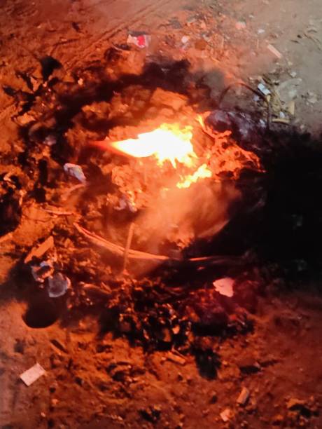 istock Burning fire in a pot on a background of brown coal. 2201215111