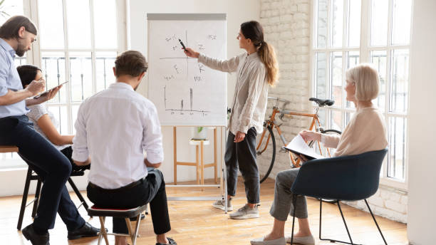 istock Busy diverse staff brainstorming taking part in seminar at boardroom 2201215939