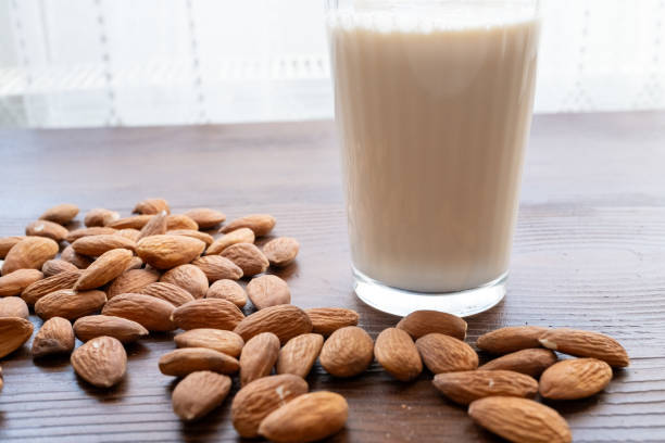 istock almonds milk and almonds on the wooden floor 2201220544