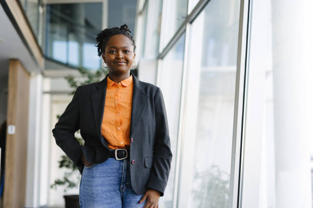 istock Confident young manager posing in modern office building 2201222217