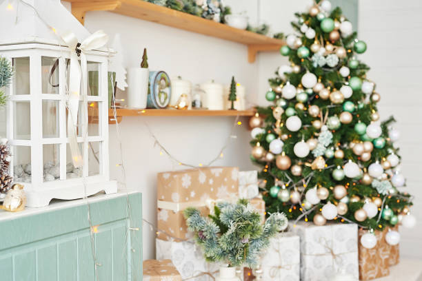 istock Christmas decor in kitchen. Christmas tableware. Christmas cooking utensils. Bright interior of New Year's cuisine. New Year card template. White Mint Colors Kitchen. Christmas tree in the kitchen. 2201224568
