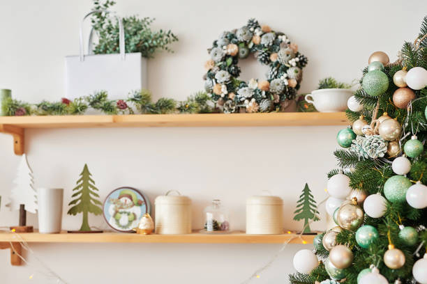 istock Christmas decor in kitchen. Christmas tableware. Christmas cooking utensils. Bright interior of New Year's cuisine. New Year card template. White Mint Colors Kitchen. Christmas tree in the kitchen. 2201224869