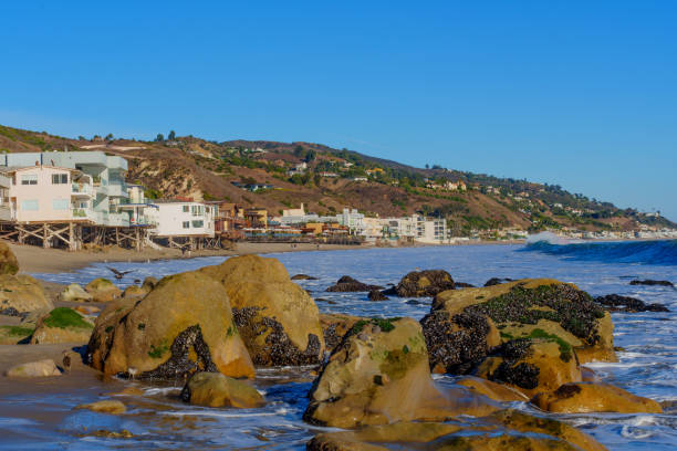 istock Rocky Shoreline at Malibu with Coastal Homes Above 2201225153