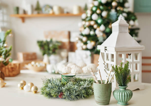 istock Christmas decor in kitchen. Christmas tableware. Christmas cooking utensils. Bright interior of New Year's cuisine. New Year card template. White Mint Colors Kitchen. Christmas tree in the kitchen. 2201225283
