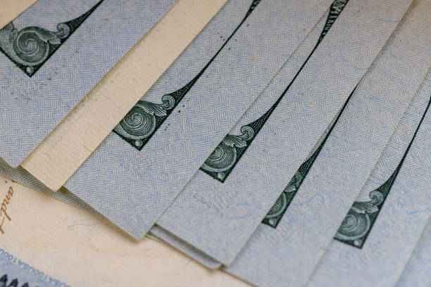 istock new and old hundred dollar bills stacked together 2201229019