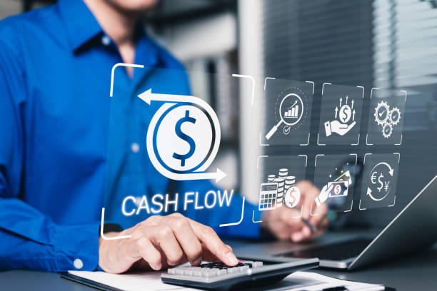 istock Cash flow management and financial analysis concept. Businessman using calculator and laptop with icons representing cash flow, financial management, budgeting, business growth, money, income, profit, 2201230894