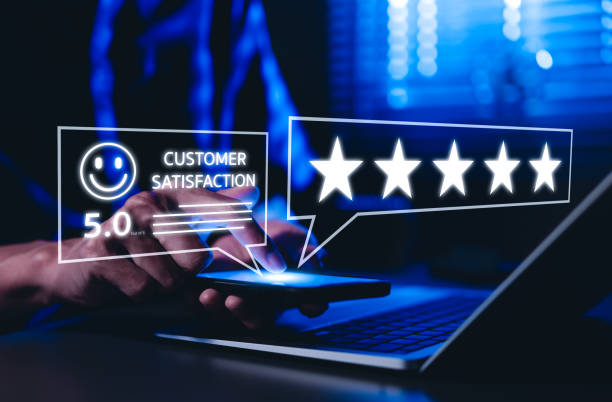 istock Five-star rating review and Customer satisfaction concept. Man using smartphone to give five-star rating, customer satisfaction, feedback, and online reviews. business reputation and quality service. 2201230901