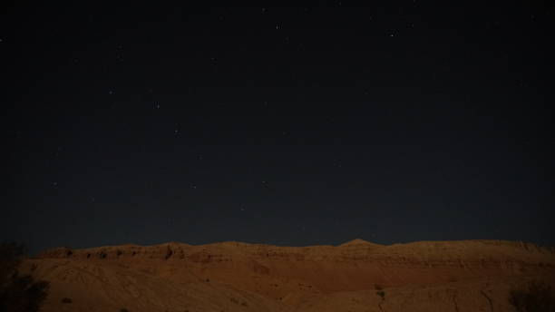 istock Starry night sky illuminating desert landscape in arizona 2201232438