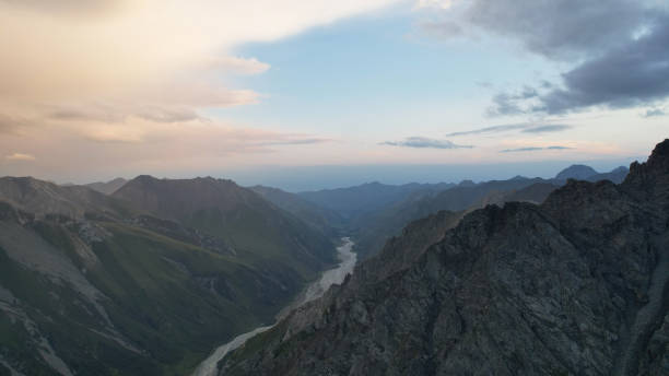 istock Breathtaking sunset over a mountain valley with a winding river 2201234102