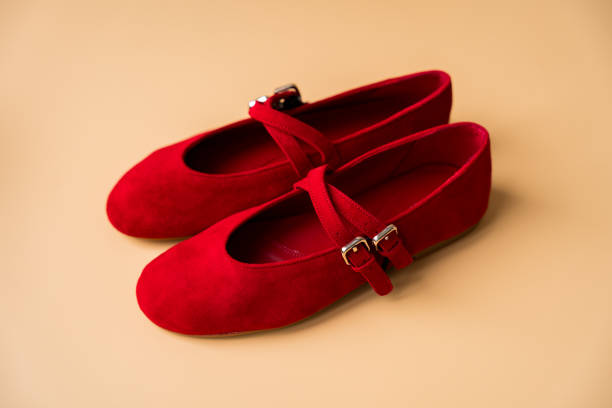 istock Red suede ballet flats with double straps on neutral background 2201237734