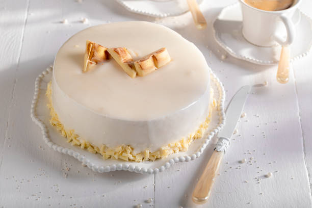 Unique white chocolate cake with brownie, white chocolate and glaze. White chocolate cake with dark cocoa sponge.
