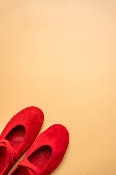 istock Red suede ballet flats on beige background with copy space 2201237748