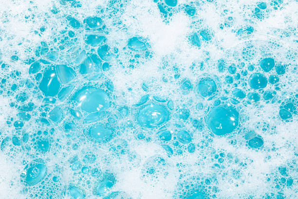 istock Bright bubbles create a vibrant texture in blue water with a foamy appearance 2201243078