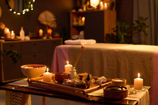 istock Wooden Table with Aroma Candles and Equipment for Massage 2201244938