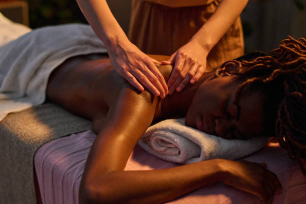 istock Relaxed Woman Enjoying Massaging in Shoulder Area 2201246230