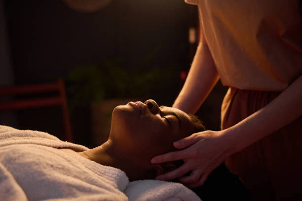 istock African American Woman Getting Head Massage at Spa 2201246526