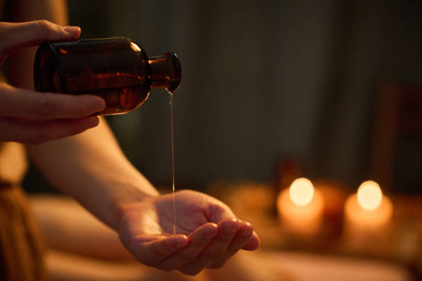 istock Unrecognizable Woman Pouring Essential oil 2201247093