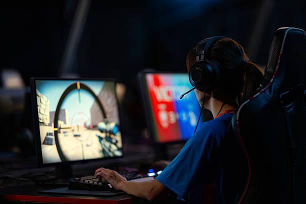 istock Female esport player focusing in FPS game 2201247533