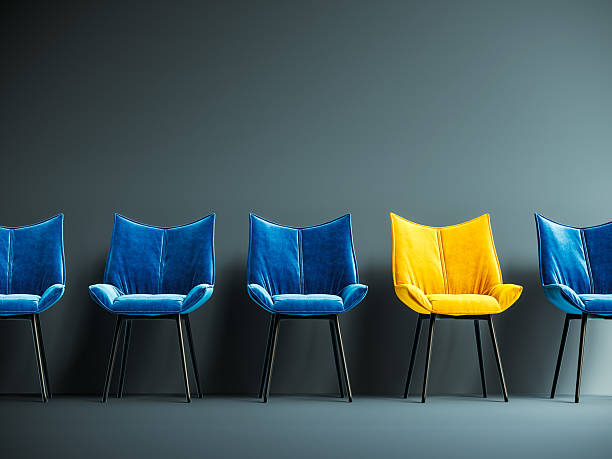 istock Hiring concept design. One empty yellow chair among many. One spot left. 2201248901