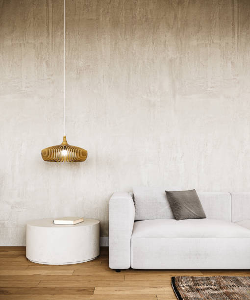 istock Beautiful living room interior design with gray sofa and empty concrete wall background. 2201248938