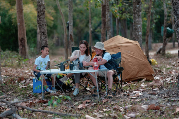 istock Happy family enjoying a camping day in springtime. 2201250032