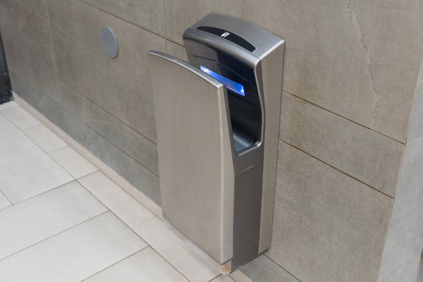 istock The sleek stainless steel waste disposal unit is mounted on a wall, providing an elegant solution for waste management in a busy area 2201253831