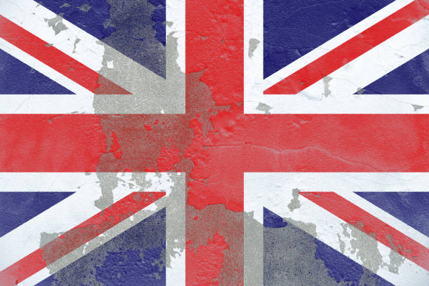 A close-up of the Union Jack flag with a distressed, aged texture, giving it a vintage and weathered appearance. The rough, peeling surface symbolizes historical changes, political struggles, and national identity shifts within the United Kingdom.
