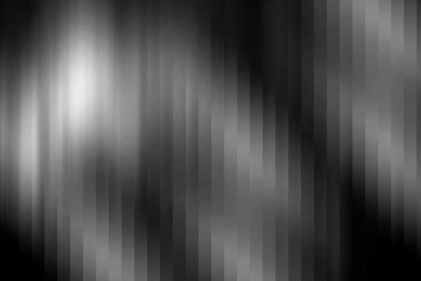 A monochrome abstract background featuring a blurred effect with vertical stripes. The grayscale gradient and soft motion create a sleek, modern, and mysterious atmosphere, perfect for contemporary and futuristic design applications.