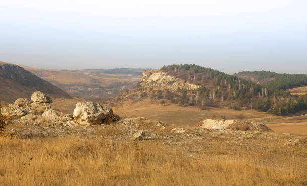 istock Beautiful landscape: hills houses valley 2201273119