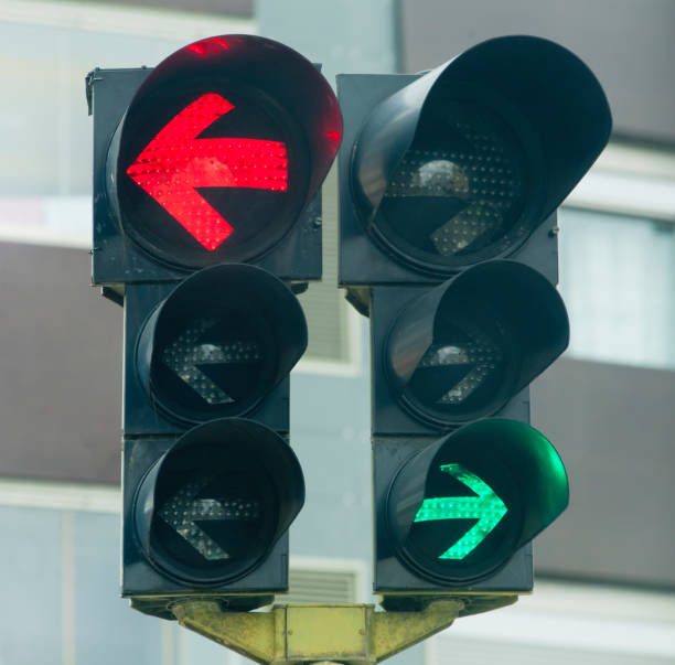 istock Traffic lights, red and green stop lights, arrow symbols . 2201273829