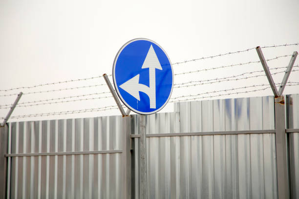 istock Straight and left turn sign 2201273951