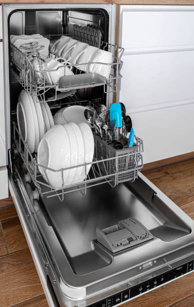 istock Built-in dishwasher in a modern kitchen with clean dishes after washing. Side view 2201274055