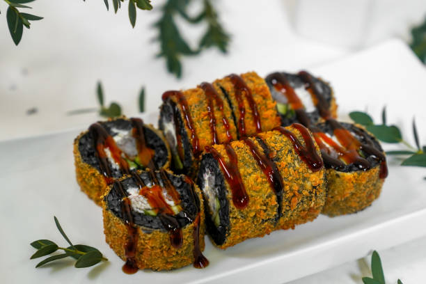 istock sushi rolls black seaweed black rice soy wasabi ginger 2201276588