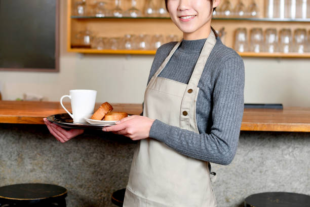 Young Asian woman working at a restaurant