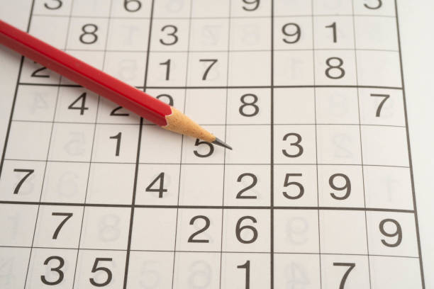 istock Sudoku puzzle, game to play for keep you brain younger for developing Alzheimer disease in senior patient. 2201284008
