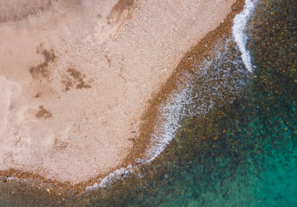 istock View from above using a drone from a perpendicular viewpoint, the natural appearance of the shoreline at Cristo Rei Beach, Dili, Timor Leste. 2201288707