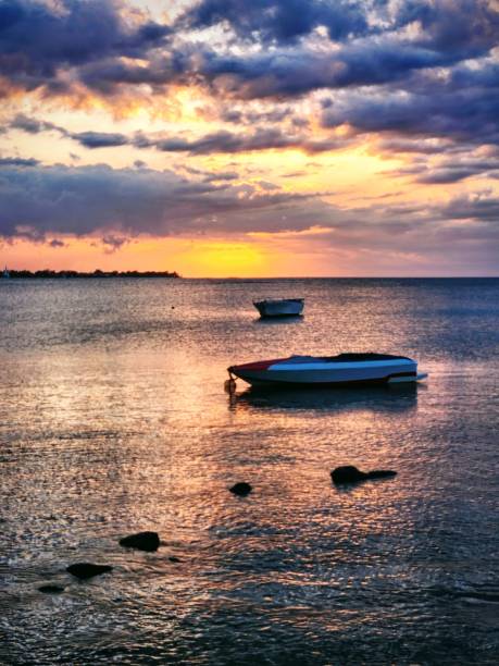 Jet boats in the Indian sea of Mauritius during a sunset