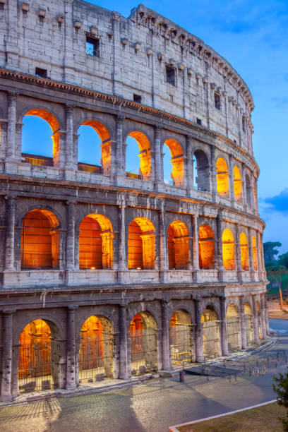 Italy. Early summer evening in Rome. The Colosseum illuminated at night