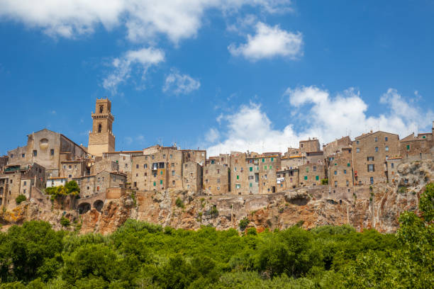 Italy. Old town Pitigliano on a sunny summer day. Rock and stone walls of old masonry