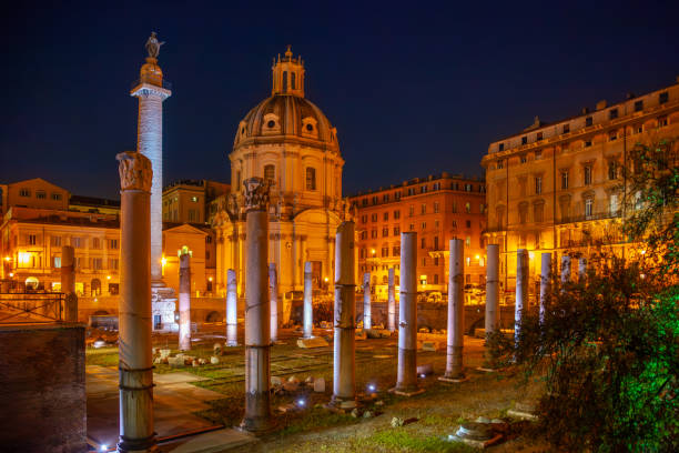 istock Cathedral and Ancient Ruins in Rome at Night 2201296246