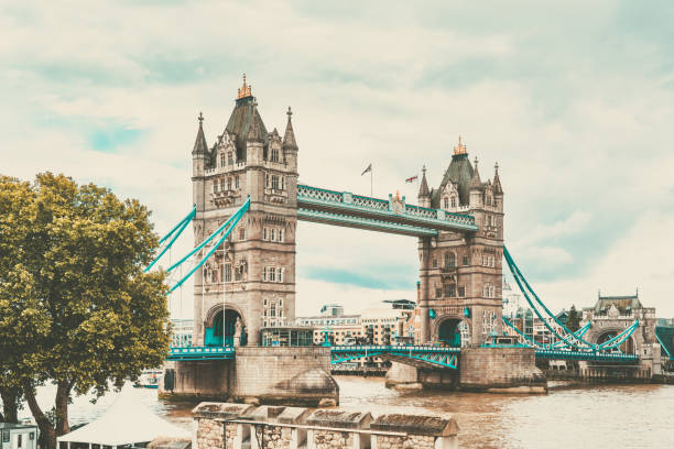 Tower bridge, an iconic landmark, stretches across the river thames in london, uk