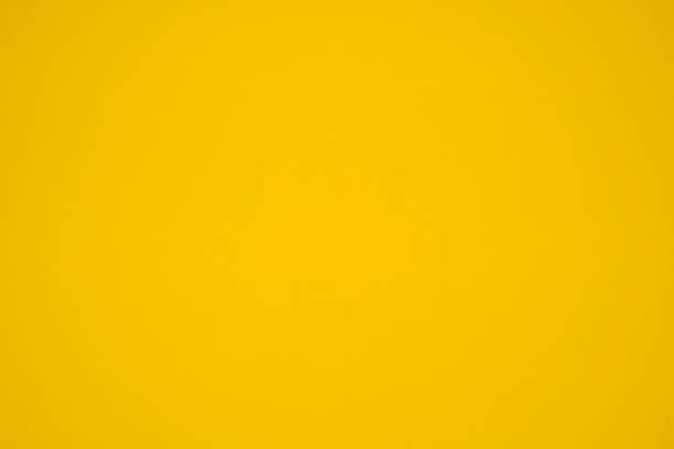 istock Lemon yellow monotone background. Lemon yellow paper. 2201298541