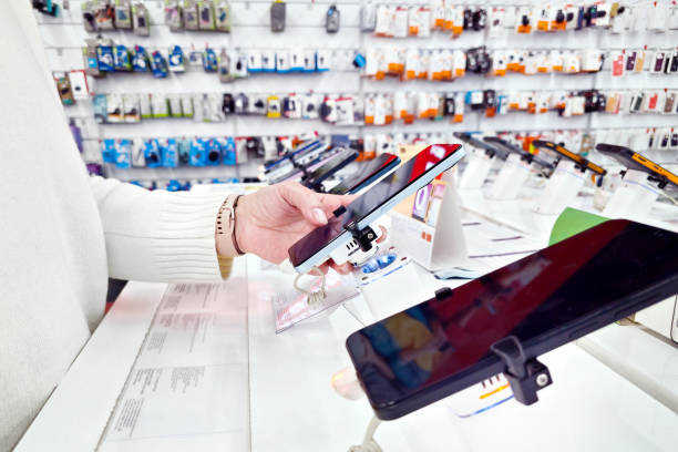 istock Woman with phone in store 2201300897