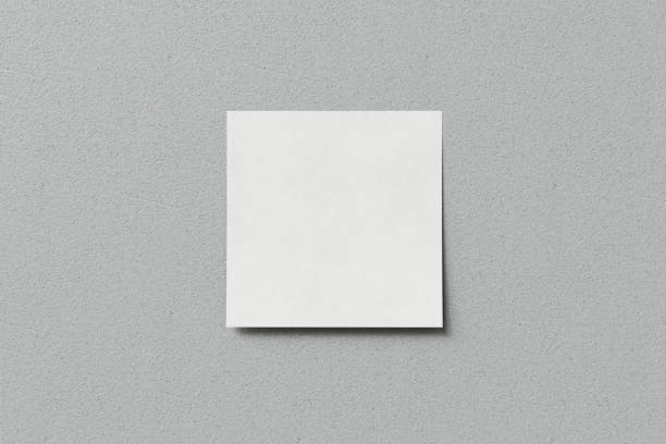 istock white sticky note on gray wall stock photo 2201301080