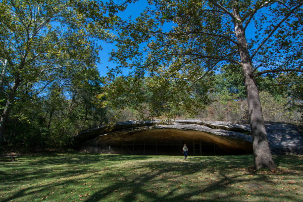 istock Graham Cave SP - Hiker Nears the Cave 2201308584